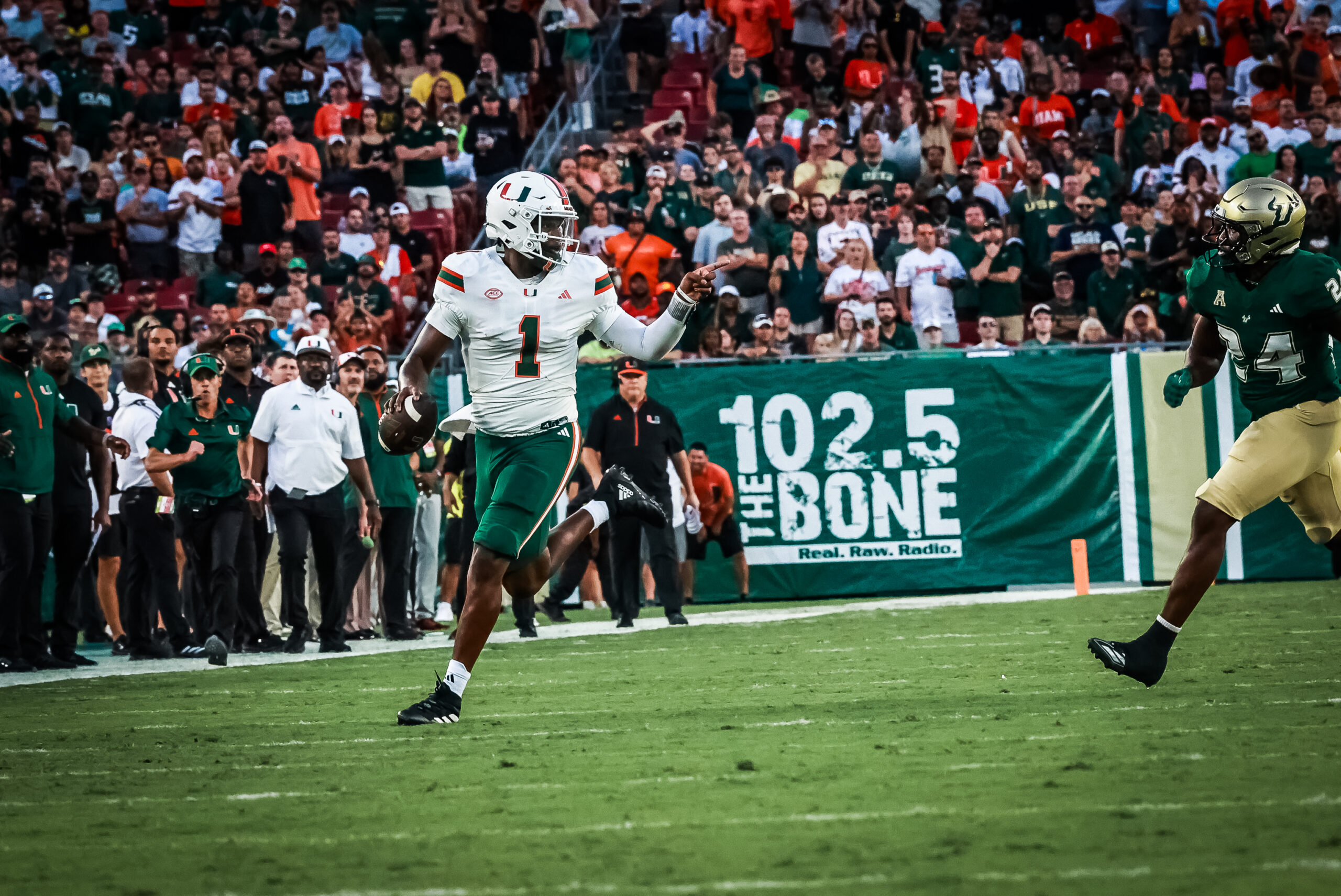 Miami QB Cam Ward points at and taunts USF defender during the Hurricanes' rout of the Bulls last weekend