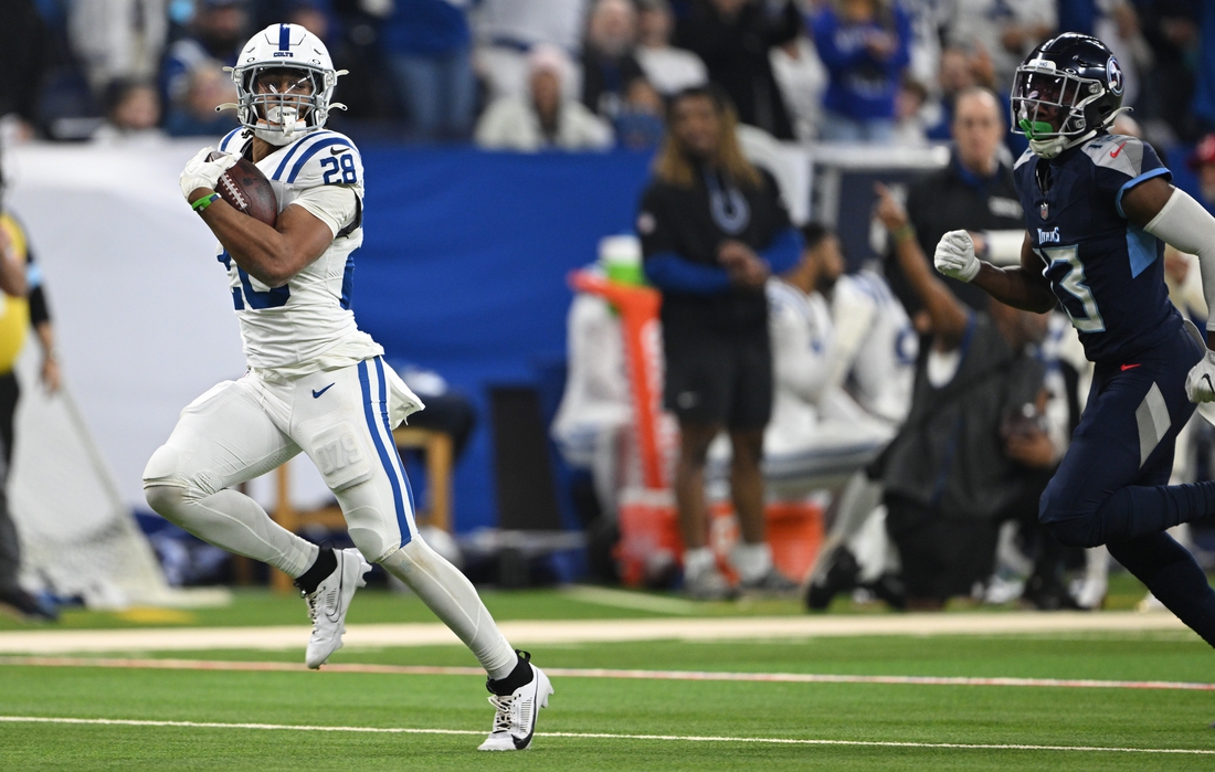 Colts rush for 335 yards to beat Titans, stay in playoff hunt