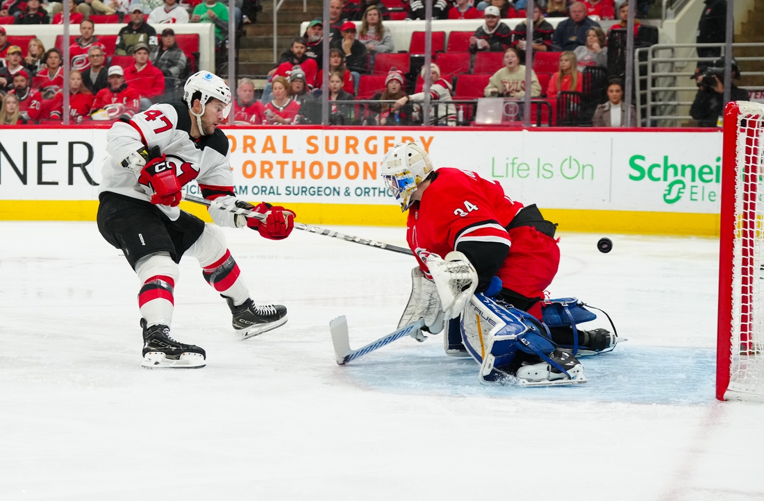 Hurricanes' four-goal third period cools off Devils